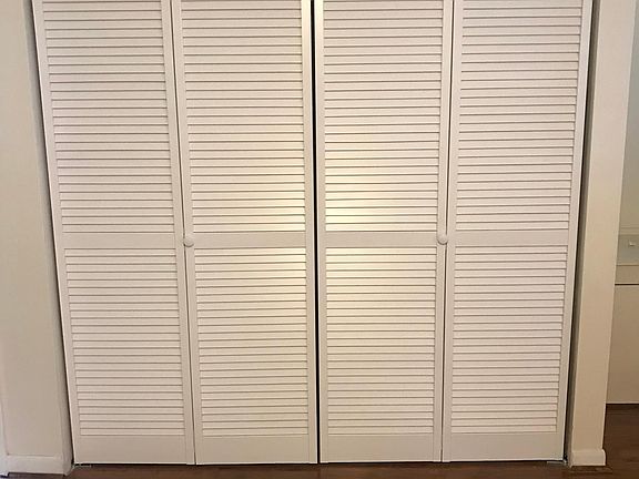 Shutter doors for laundry area in kitchen