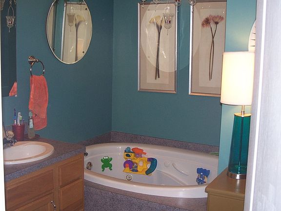 bath with whirlpool tub and separate shower