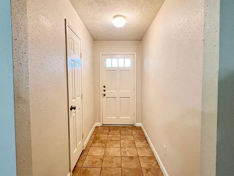 The entry with a hall closet.