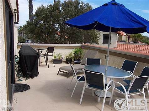 Spacious back deck that extends the whole width of the condominium.  Perfect for BBQ's with family and friends