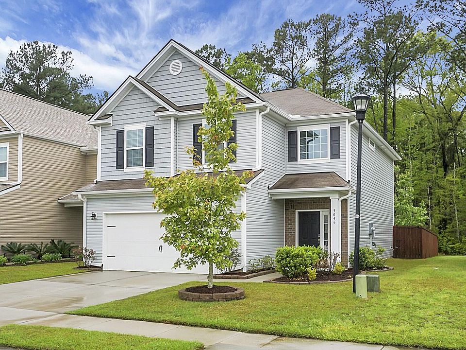 Nice curb appeal, backs up to wooded area