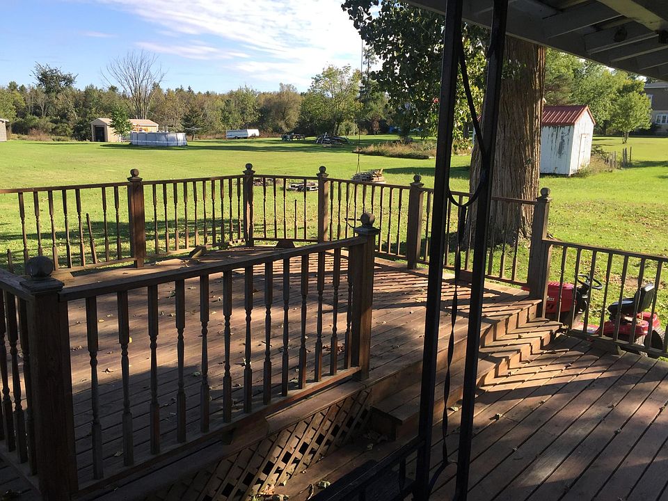 Front porch view of deck and yard