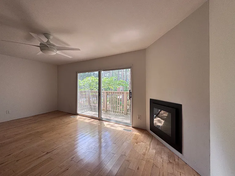 Dining room or Den on the main floor at the rear of the house. It's spacious enough to hold a full dining room set with a large table or a smaller table and a sitting area.