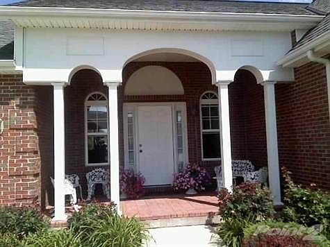This beautiful covered front porch awaits your arrival.
