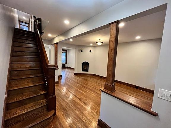Entryway, Stairs to 2nd floor and Living Room View