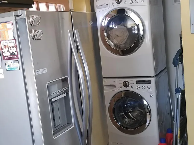 Modern refrigerator and washer dryer.