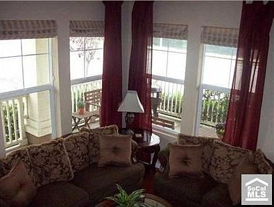 Living room with vaulted ceiling and lots of light
