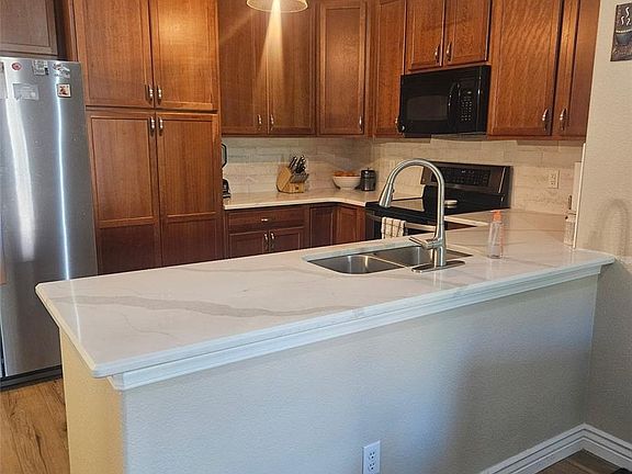5th image of 8779 S Kipling Way #204
