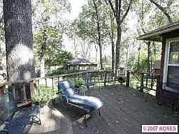 Large Deck overlooks park-like backyard