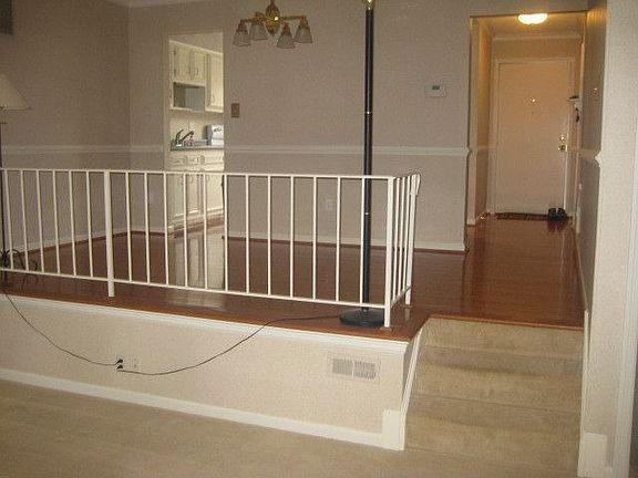 dining room, drop down is living room; front door and kitchen entry.