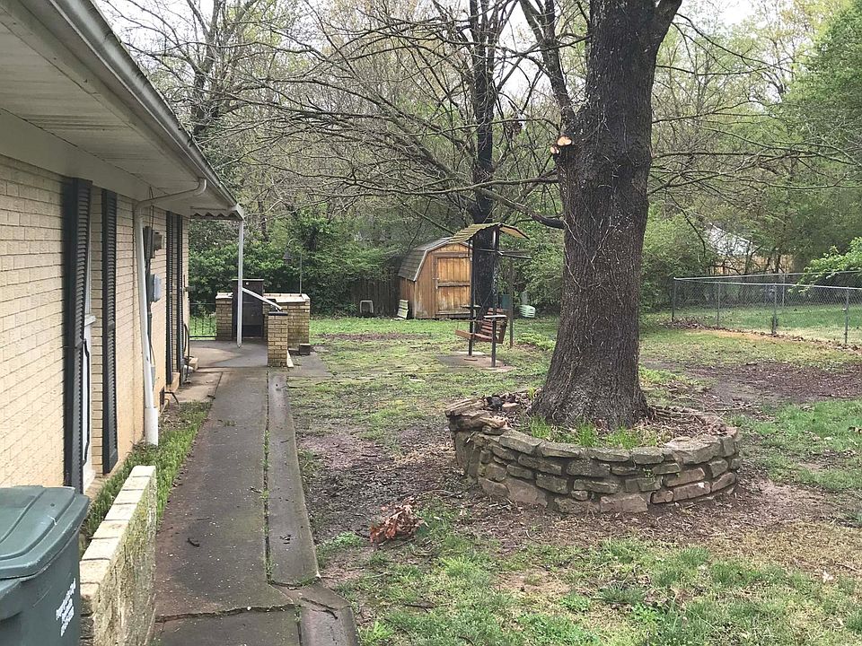 Front of house looking east along south wall of house