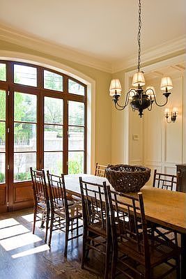 DINING ROOM W MAHOGANY DOORS WHICH OPEN TO PRIVATE WALLED GARDEN