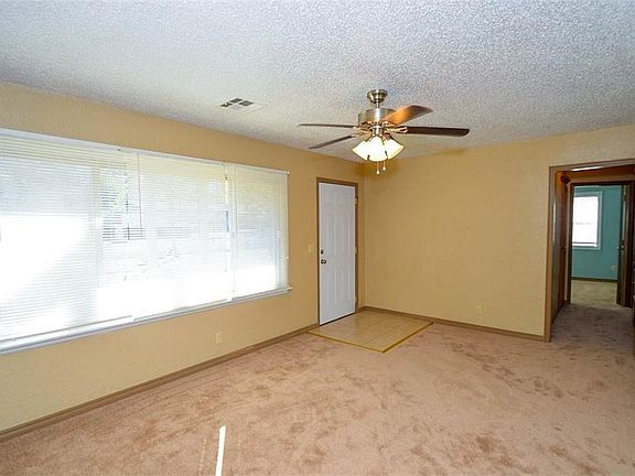 Living room view of east windows and front door