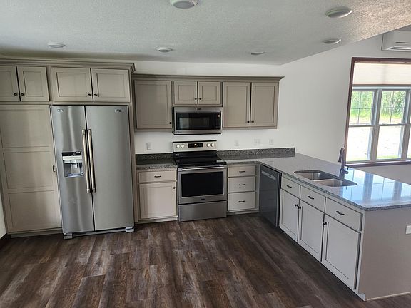 Open kitchen - stainless steel appliances