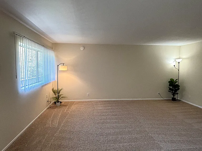Unit 210B:
View of Bright and Spacious Living Room from Kitchen