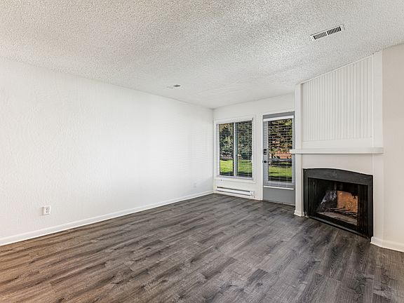 Living room with wood burning fireplace