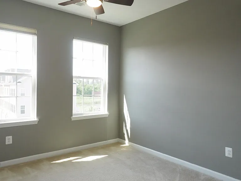 The front bedroom looks out onto the street.