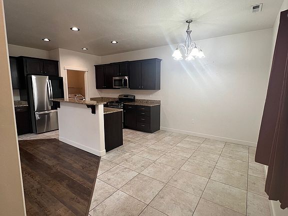 Tiled dining area next to the kitchen.