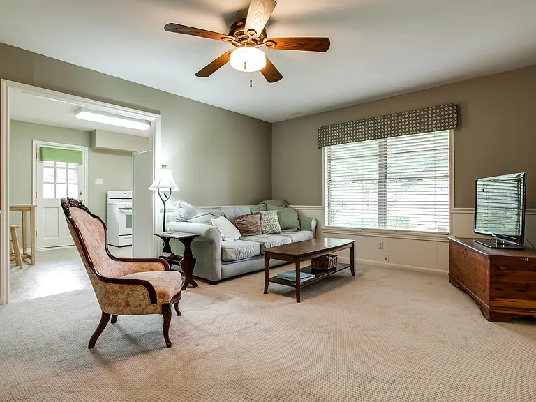 Third room is flex space (bedroom, home office, second living/play area), has a closet and dual entry points with doors. Refinished wood floors - NO carpet.