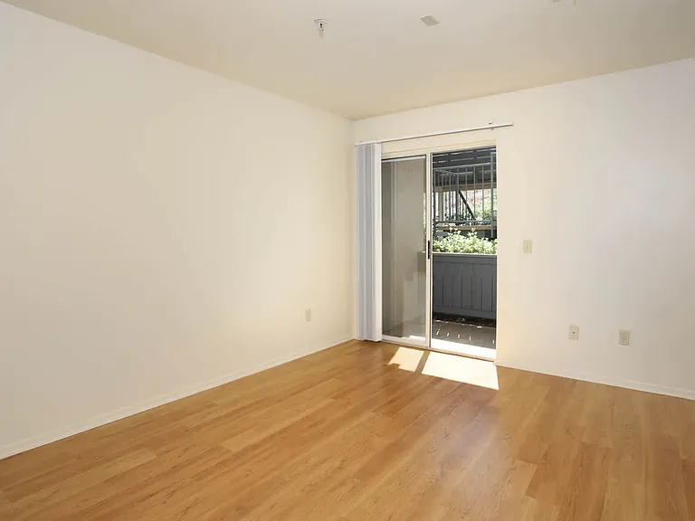 Bedroom with Hard Surface Flooring and Patio