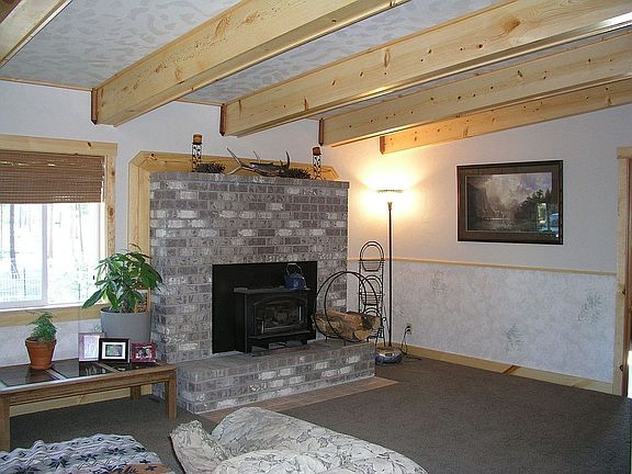 Living Room hand-finished pine wrapped beams