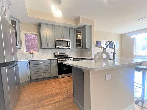 Upgraded kitchen with new appliances.