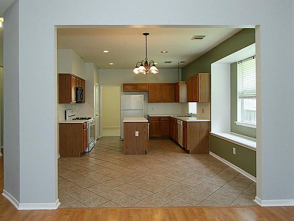 The kitchen and breakfast room has easy to clean tile flooring.