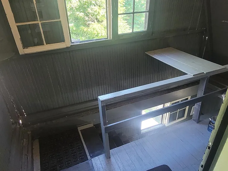 Backstaircase with your own back, porch and windows. Off the kitchen.