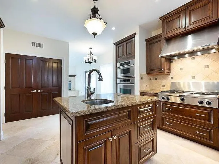 Kitchen adjacent to big Family Room and nearby Laundry Closet with full size washer/dryer.