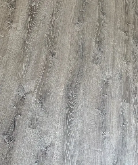 Flooring throughout- bathroom has grey floor tile.