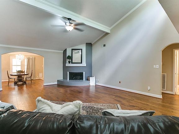 The high ceilings with windows allow natural light to fill the living room.