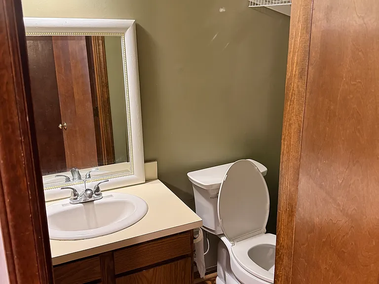 Half bath on the first floor next to the kitchen.