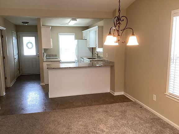 Nice eating area with light fixture.