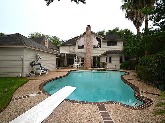 Enjoy a view of the back of this home from the fully fenced backyard.