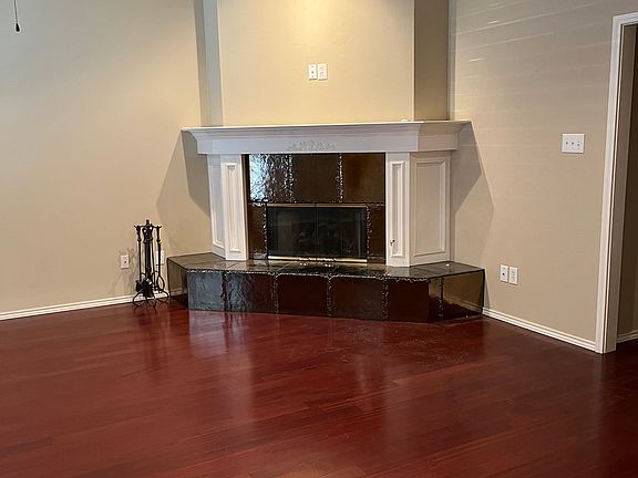 Living room with beautiful wood floors and fireplace