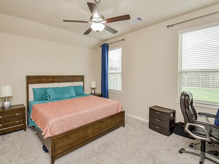 Primary master bedroom is huge. For context, this picture shows a KING size bed with 2 oversized nightstands. Also present (out of view) are a full desk/workstation, big dresser, 65-inch TV. All fit with plenty of space. Too large to capture in one shot.