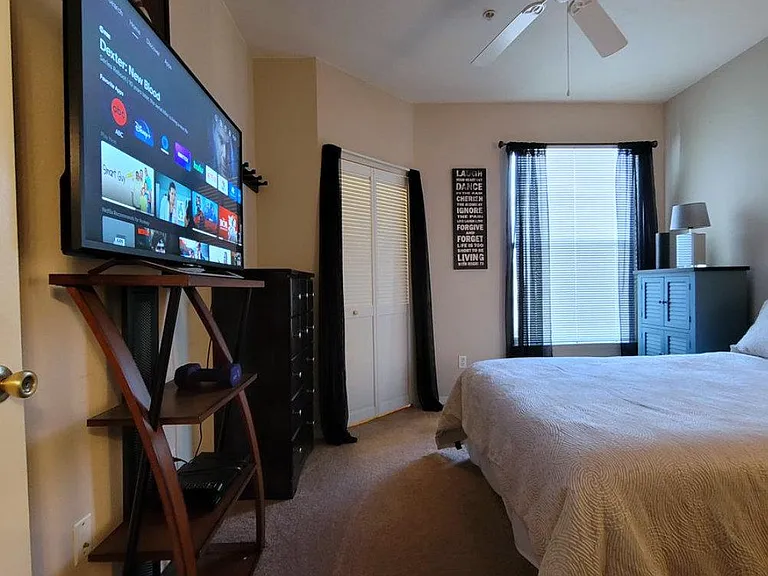 Cozy owners suite includes 4K TV & stand + walk-in closet.