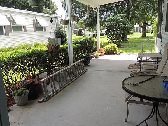 Patio behind carport/shed