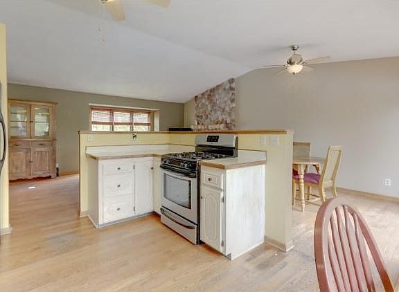 OPEN SPACIOUS FEEL BUYERS WILL LOVE! VAULTED CEILINGS AND STONE GAS FIREPLACE