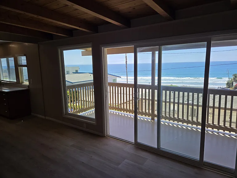 Living room balcony facing ocean.