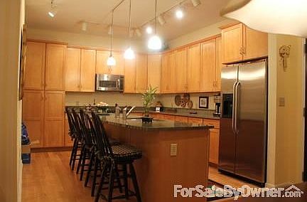 Lovely kitchen with eat-in island
						:
						Beautiful granite - great for entertaining! Textured walls- Must see special