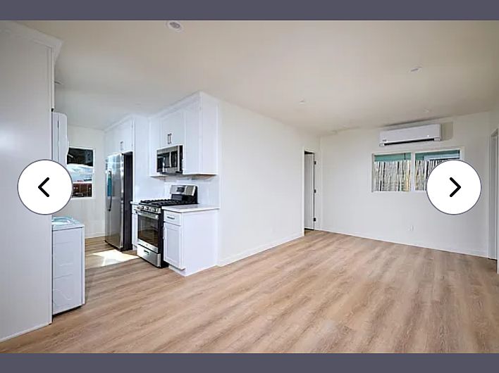 Kitchen and family room from the front door entrance area. Very roomy for your sectional.