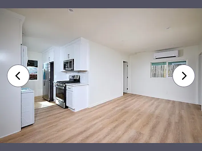 Kitchen and family room from the front door entrance area. Very roomy for your sectional.