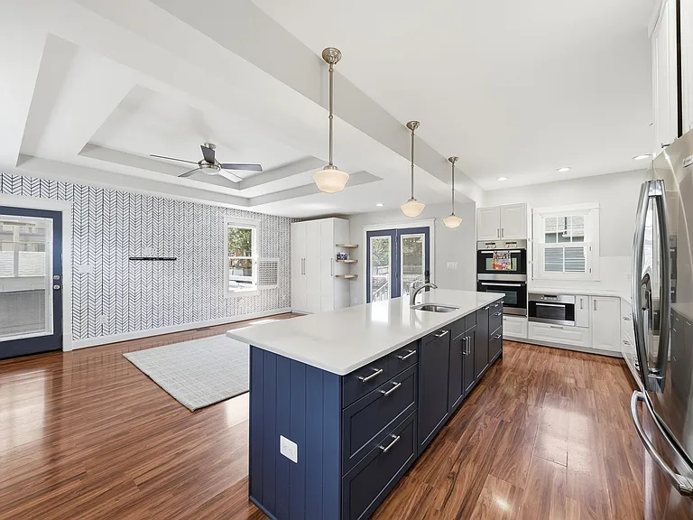 Open-concept kitchen overlooking the family room