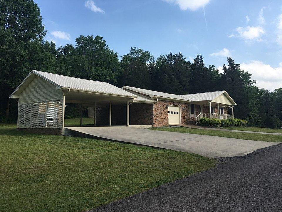 Covered parking and side porch.