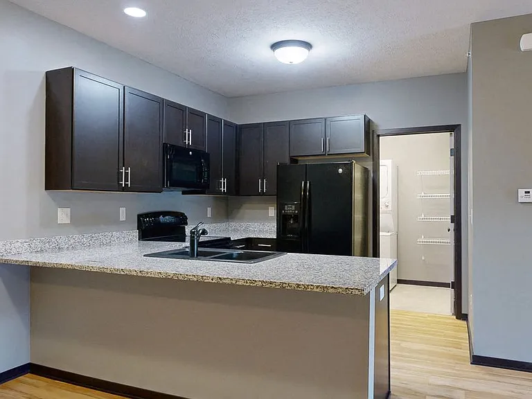 A spacious breakfast bar provides extra seating and a stylish space to gather.