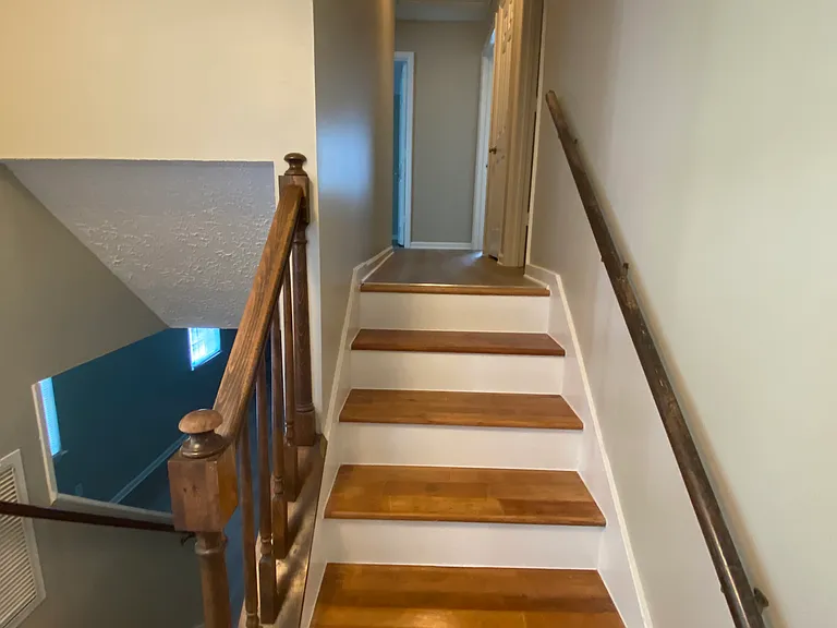 View of newly refinished steps and upstairs hallway