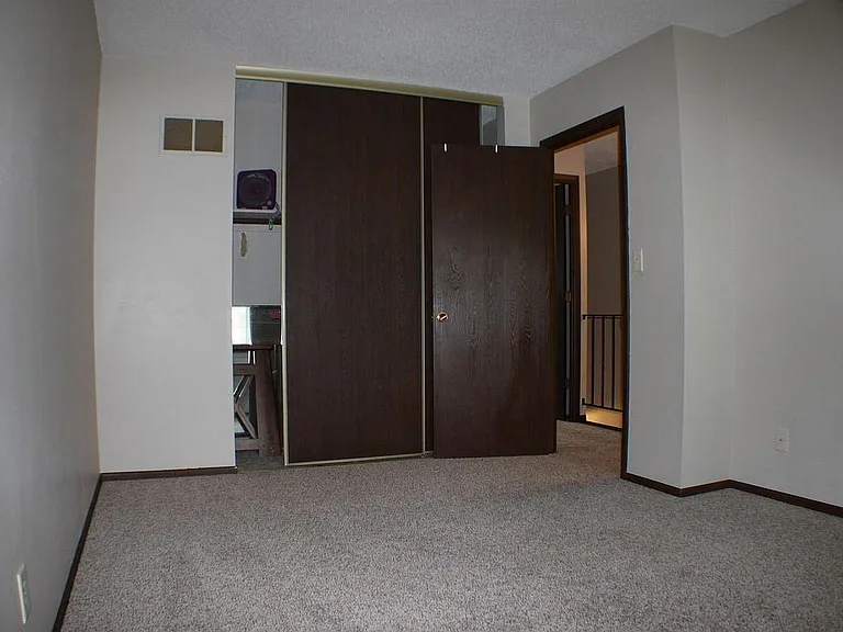 Upstairs back bedroom.