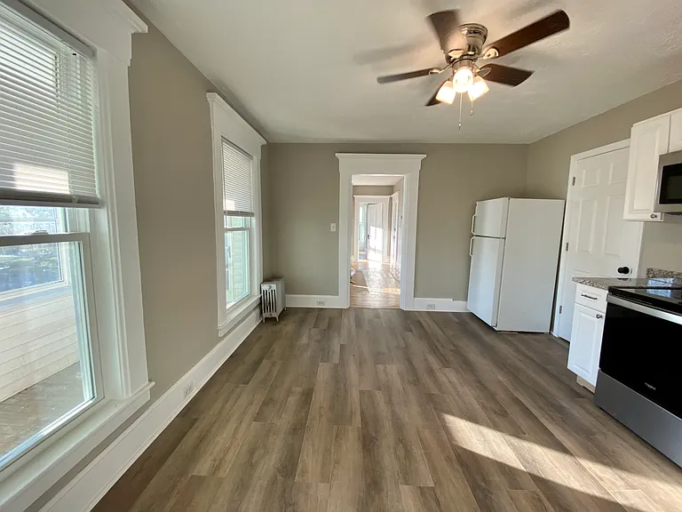 Kitchen with view to enclosed porch.