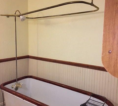 Clawfoot tub with Brass Cobra head feet